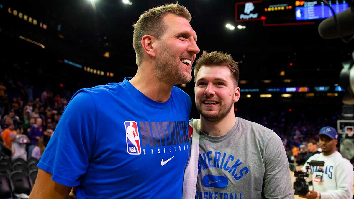 Dallas Mavericks oguard Luka Doncic (right) with former player Dirk Nowitzki against the Phoenix Suns in game seven of the second round for the 2022 NBA playoffs at Footprint Center.