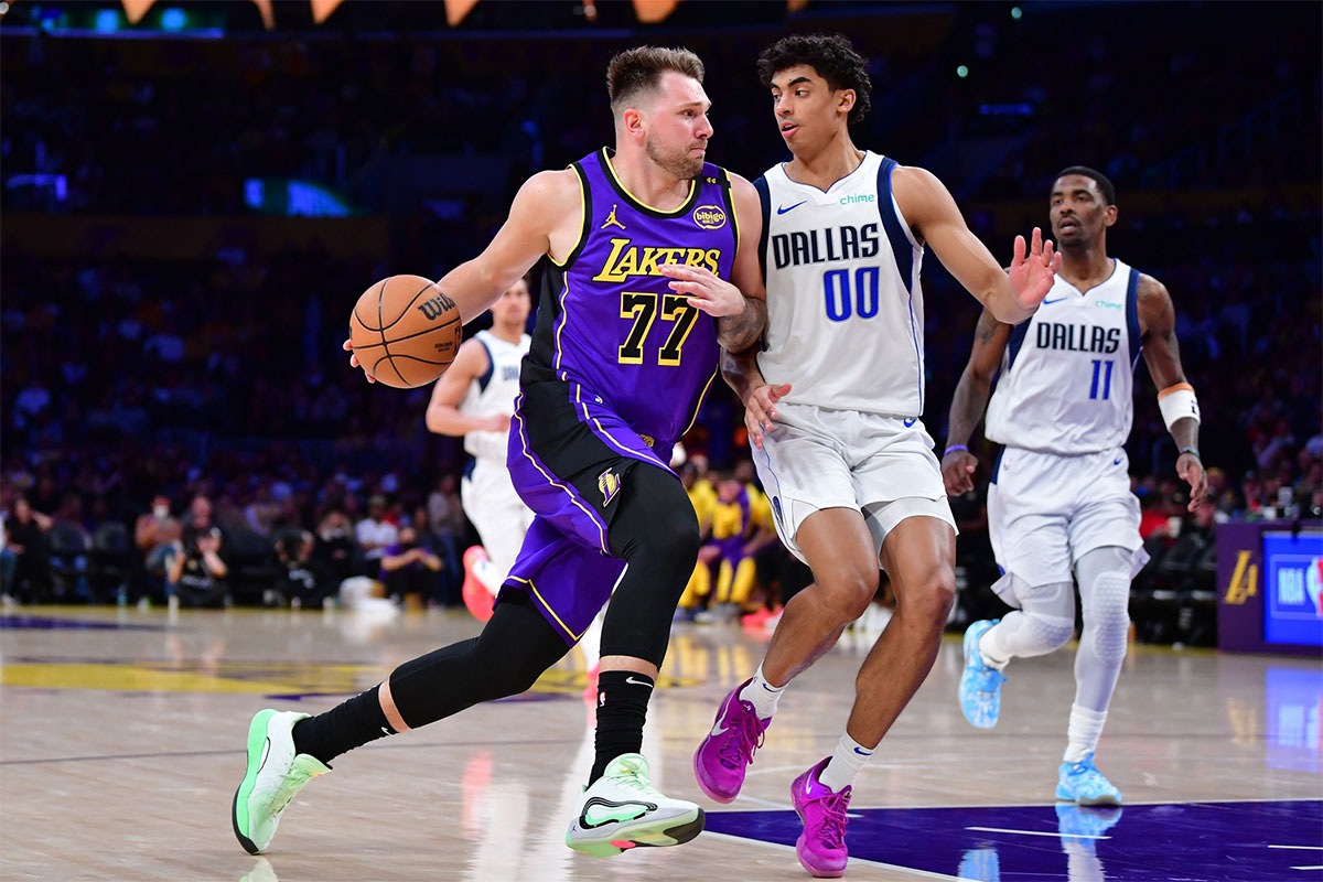 Los Angeles Lakers guard Luka Doncic (77) dribbles the ball Dallas Mavericks guard Max Christie (00) during the second half at Crypto.com Arena.