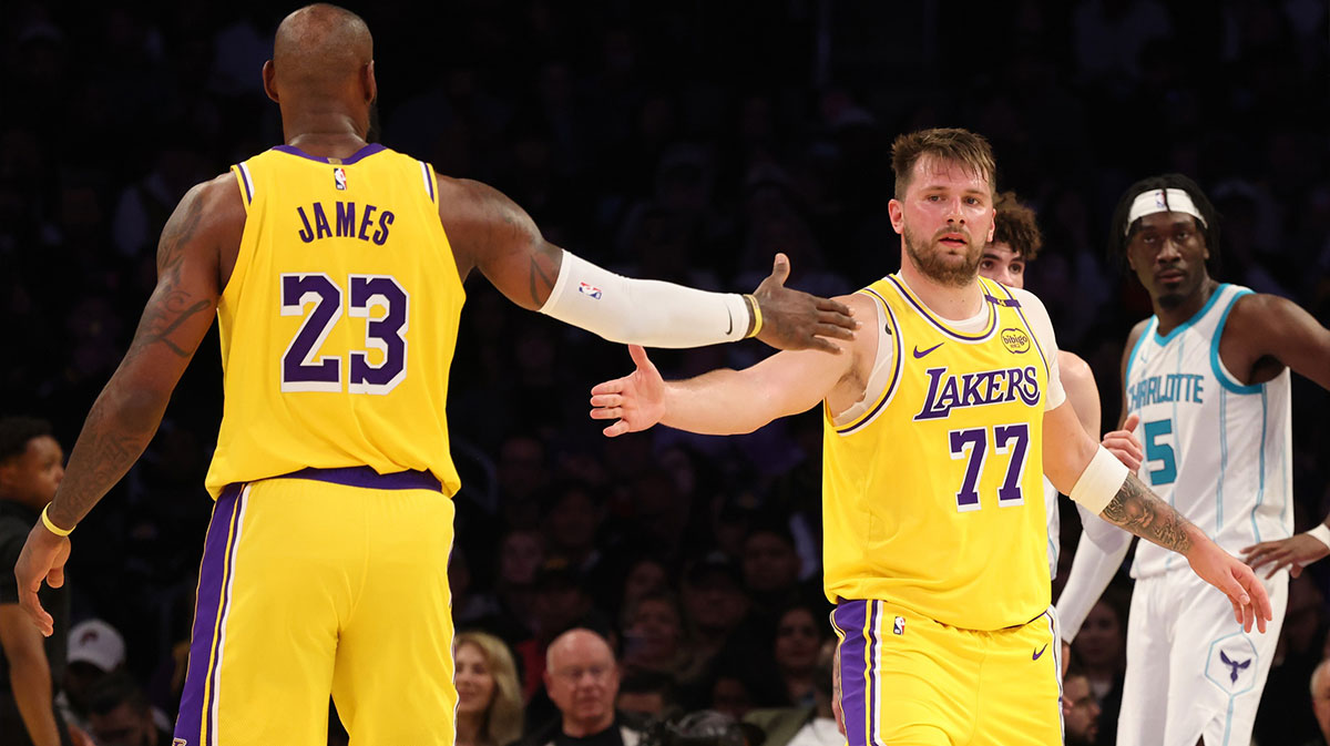 Los Angeles Lebron James (23) and Guard Luke Doncic (77) Glory After Game During the third quarter against Charlotte Hornet at the Cripto.com Arena. 