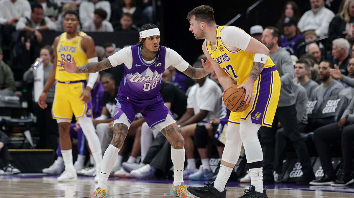 Los Angeles Lakers Guard Luka Doncic (77) Protects the ball from Jazz Guard Juta Jazz Jordan Clarkson during the second half in Delta Centur.