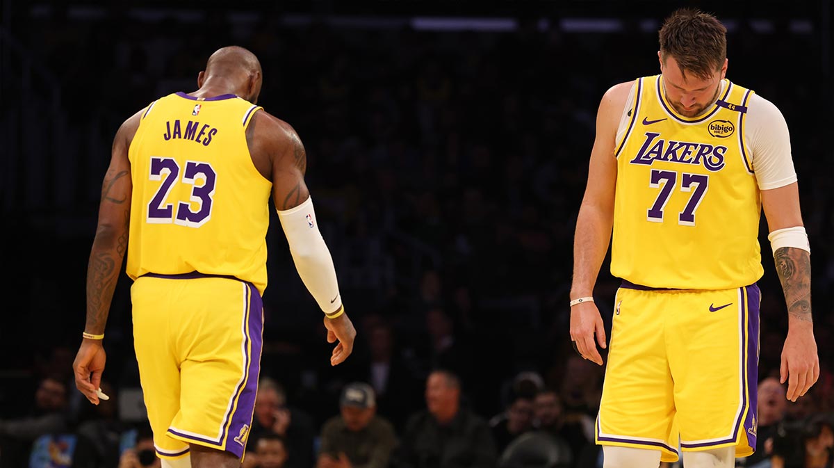 Los Angeles Lakers forward LeBron James (23) and guard Luka Doncic (77) during the first quarter against the Charlotte Hornets at Crypto.com Arena.  