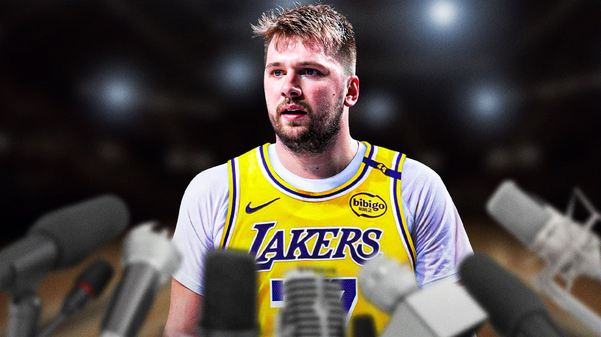 Photo: Luka Doncic in Lakers jersey talking into a bunch of microphones