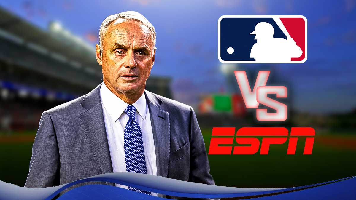 Baseball commissioner Rob Manfred with the MLB logo and the ESPN logo with a VS between the logos as contract dispute becomes public.