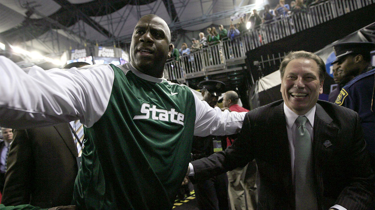 Former Michigan State player Magic Johnson and coach Tom Izzo leave the game after the team beat Connecticut 82-73 in the NCAA Final Four game at Ford Field on Saturday, April 4, 2009 in Detroit.