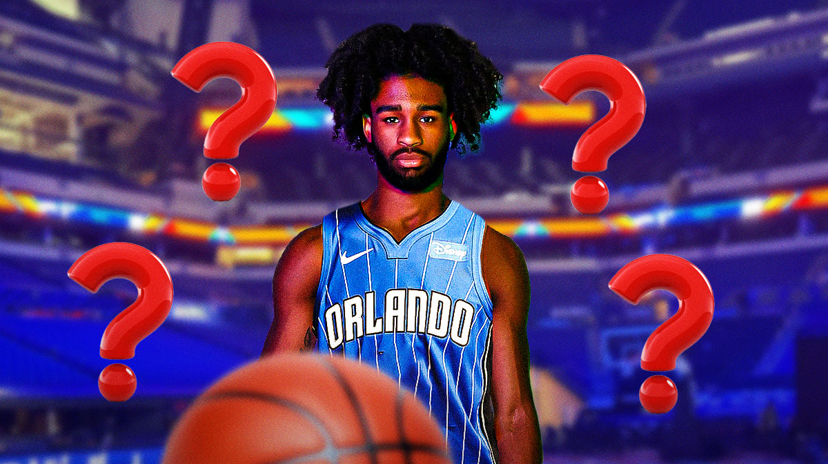 Coby White in a Magic jersey with question marks around the picture.