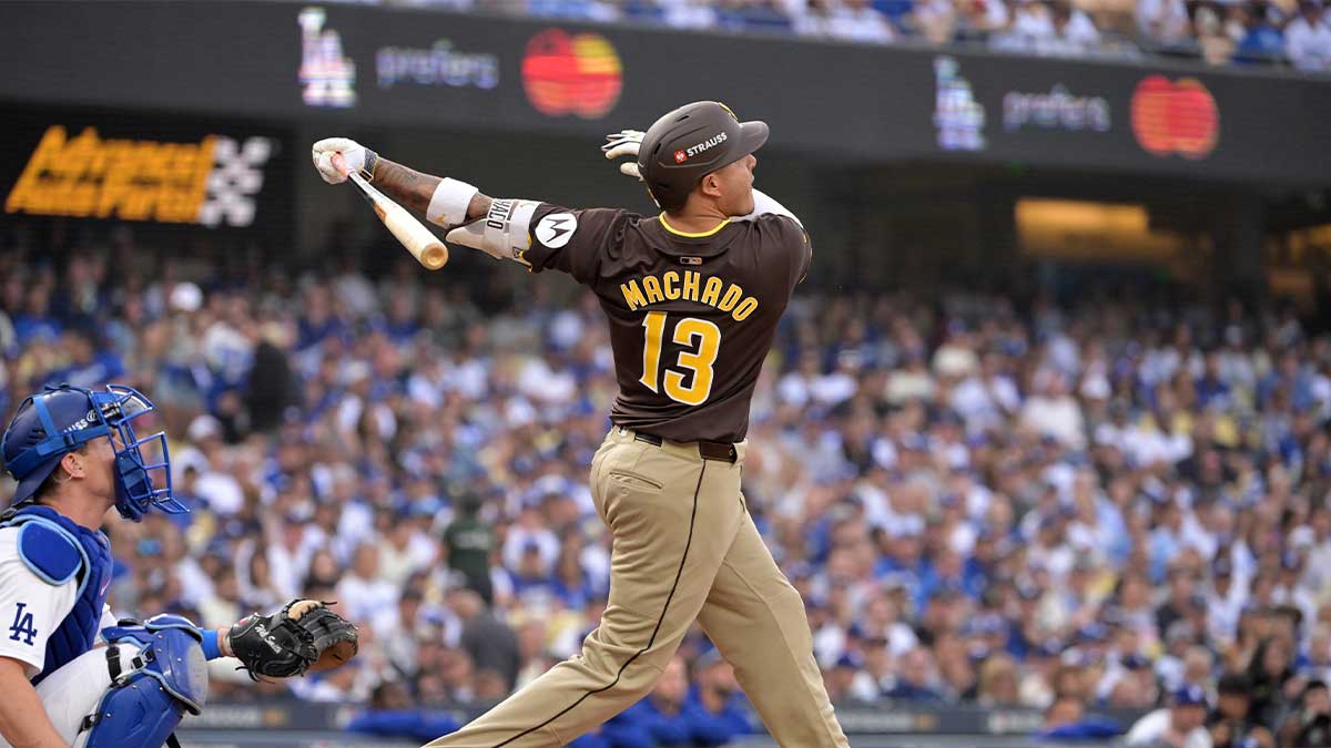 San Diego Padres third baseman Manny Machado (13) flies out in the second inning against the Los Angeles Dodgers during game five of the NLDS for the 2024 MLB Playoffs at Dodger Stadium.