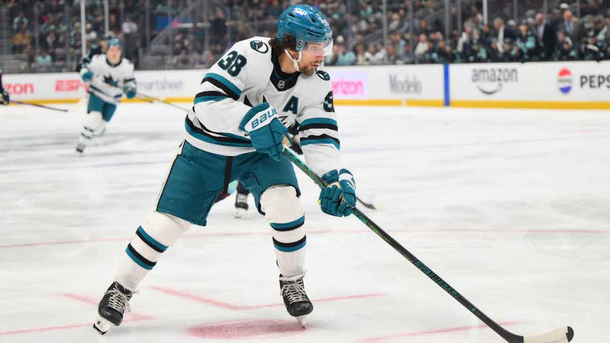 San Jose Sharks defenseman Mario Ferraro (38) plays the puck during the first period against the Seattle Kraken at Climate Pledge Arena.