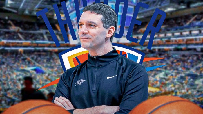 Thunder head coach Mark Daigneault next to the Thunder and Timberwolves logos