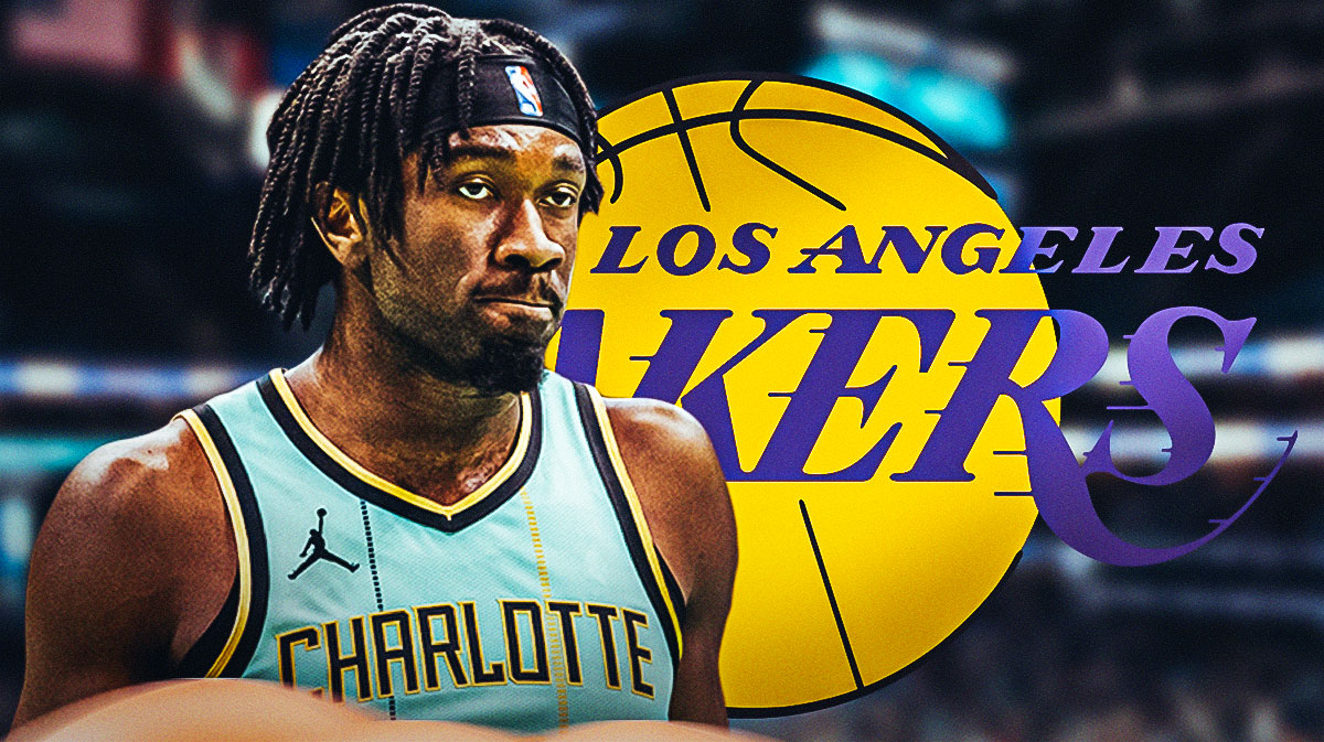 Hornets Mark Williams, mad looking next to Lakers logo