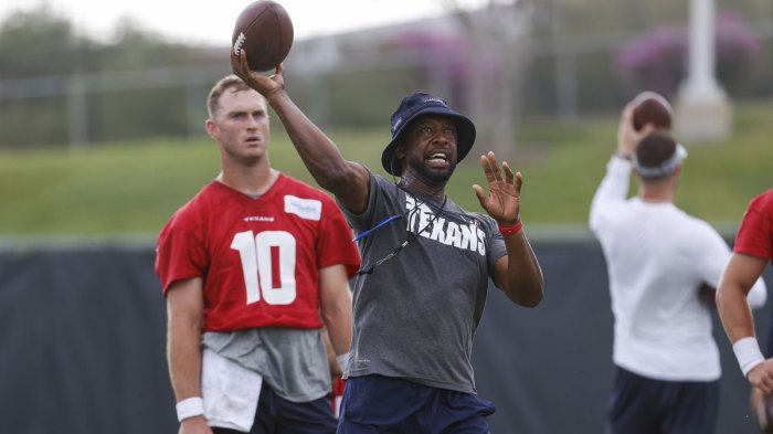 Houston Texans quarterback Davis Mills (10) looks on as offensive coordinator Pep Hamilton throws the ball during drills during minicamp at Houston Methodist Training Center.