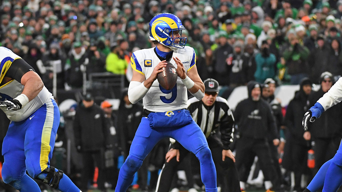 Jan 19, 2025; Philadelphia, Pennsylvania, USA; Los Angeles Rams quarterback Matthew Stafford (9) looks for a receiver against the Philadelphia Eagles in a 2025 NFC divisional round game at Lincoln Financial Field.