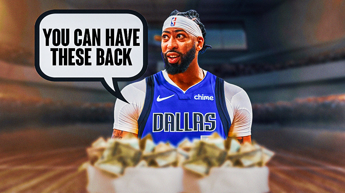 Dallas Mavericks big man Anthony Davis with a pair of money bags in front of him
