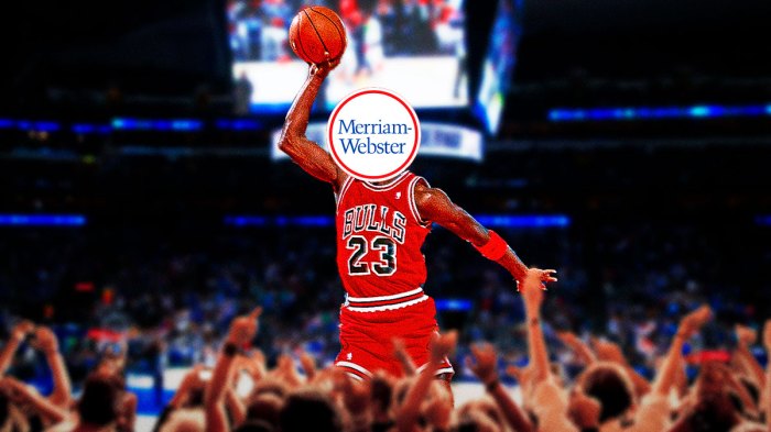 Michael Jordan in the dunk contest doing his signature free-throw line dunk. However, Jordan’s face has the Merriam Webster dictionary logo covering it