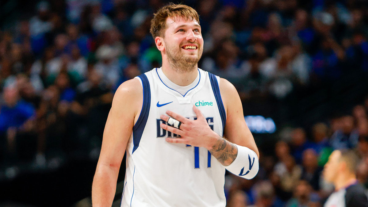 Dallas Mavericks guard Luka Doncic (77) smiles during the fourth quarter against the Houston Rockets at American Airlines Center.