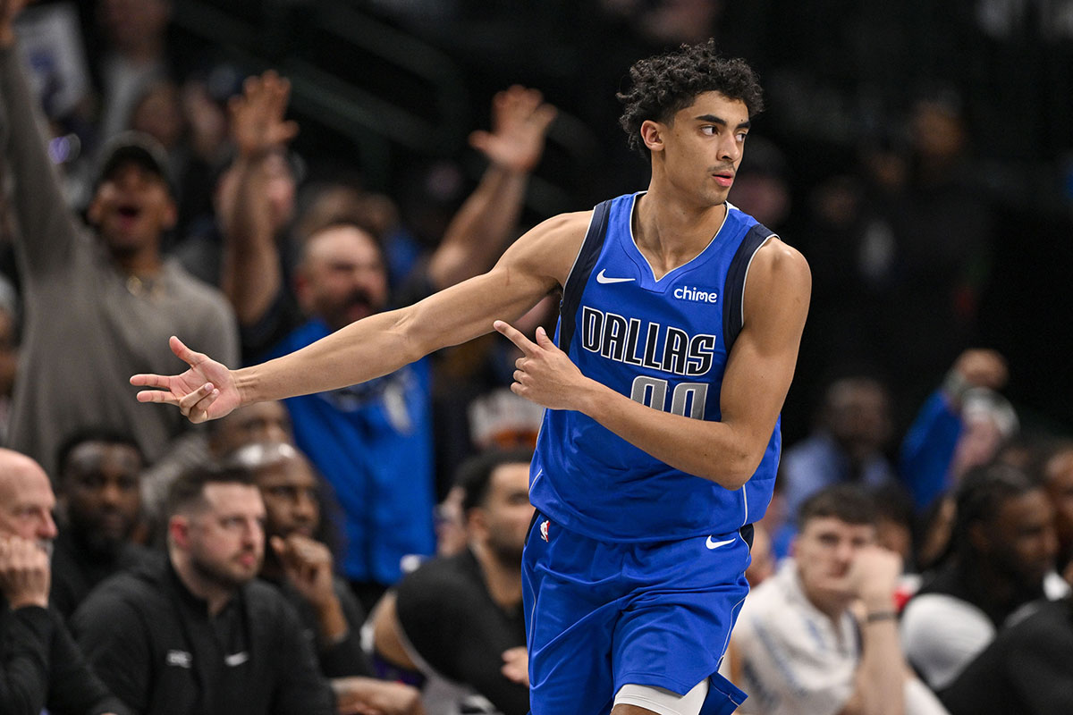 Dallas Mavericks Guard Max Christie (00) Celebrates a basket with three points during overtime against Sacramento Kings in the center of American Airlines.