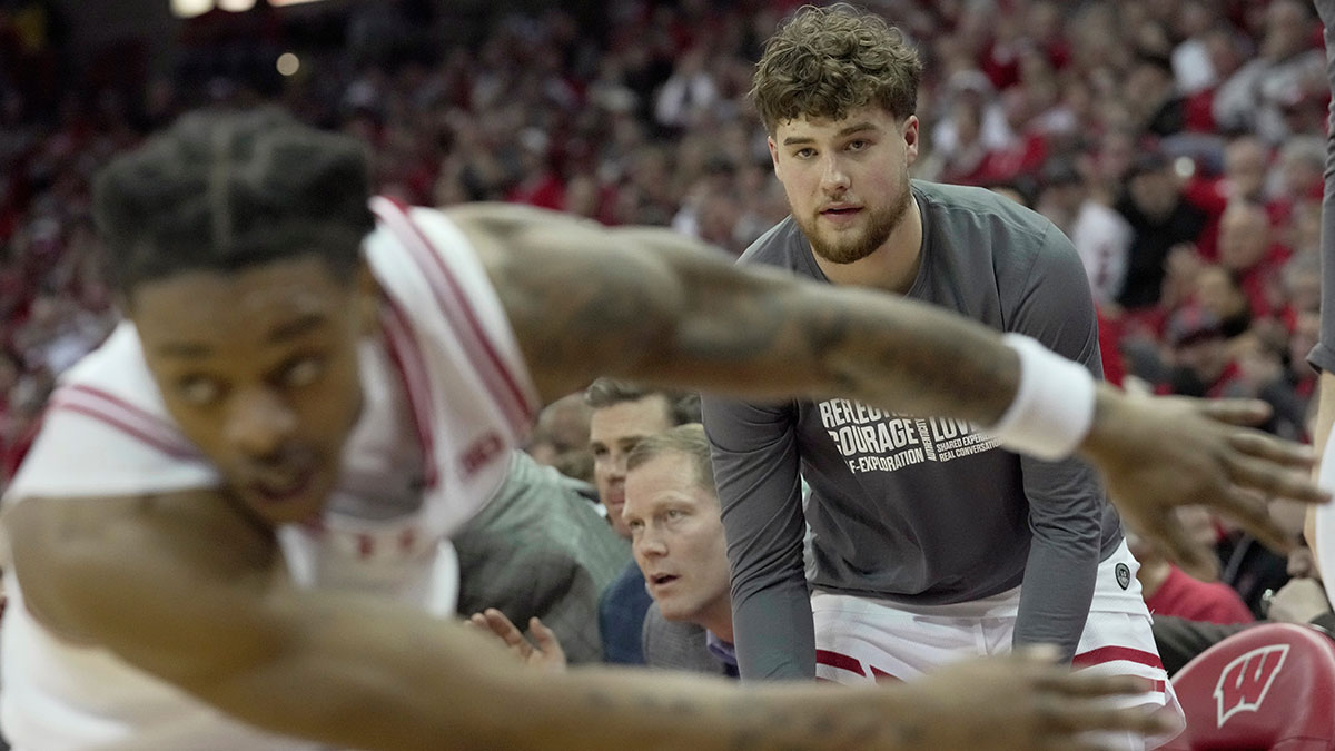 Wisconsin guard Max Klesmit (11) watches from the bench during the second half of their game Tuesday, February 25, 2025 at the Kohl Center