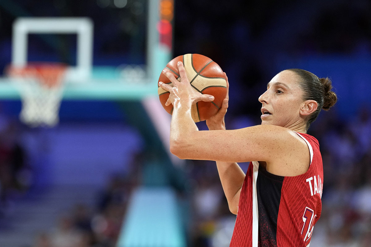 United States shooting guard Diana Taurasi (12) controls the ball against Germany in the first half in a women’s group C game during the Paris 2024 Olympic Summer Games at Stade Pierre-Mauroy. 