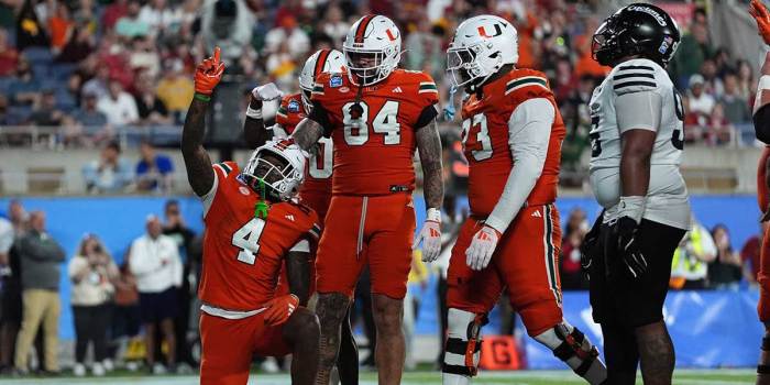 Dec 28, 2024; Orlando, FL, USA; Miami Hurricanes running back Mark Fletcher Jr. (4) celebrates after scoring a touchdown against the Iowa State Cyclones during the second half at Camping World Stadium. Mandatory Credit: Jasen Vinlove-Imagn Images