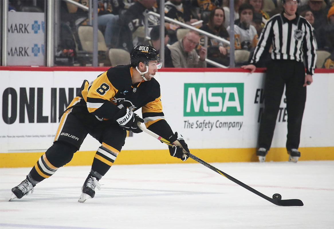 Pittsburgh Penguins left wing Michael Bunting (8) moves the puck against the New York Rangers during the second period at PPG Paints Arena. 