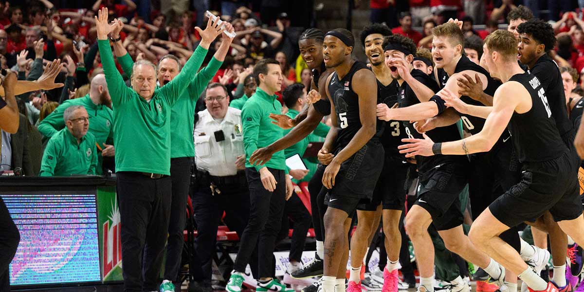 Michigan State Spartans celebrate after a shot by Michigan State Spartans guard Tre Holloman (5) goes in at the buzzer against the Maryland Terrapins during the second half at Xfinity Center.