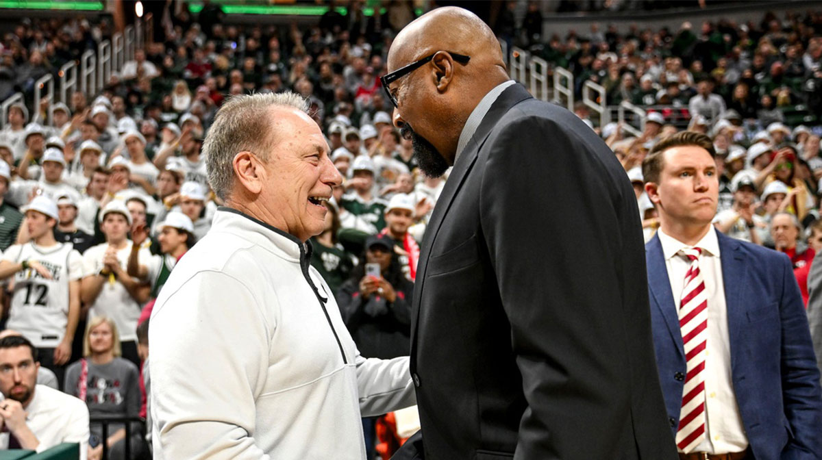 Michigan State's head coach Tom Izzo, left, shakes hands with Indiana's head coach Mike Woodson before the game