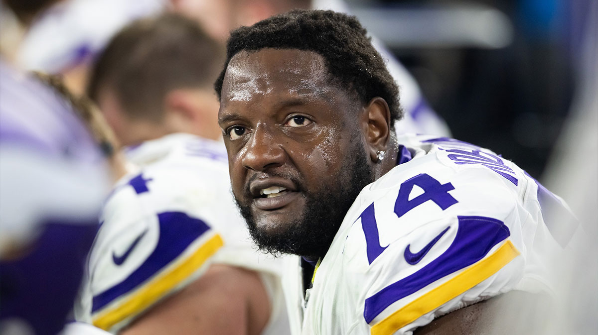 Minnesota Vikings tackle Cam Robinson (74) against the Los Angeles Rams during an NFC wild card game at State Farm Stadium.