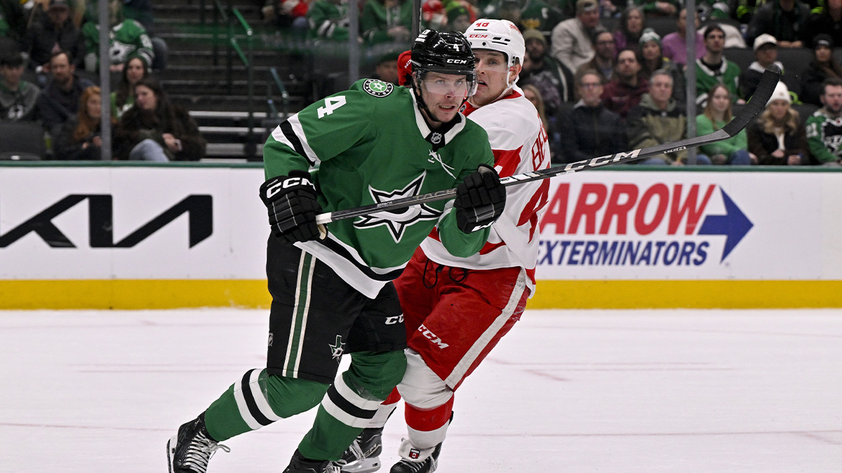 Dallas Stars Defenseman Miro Heiskanen (4) and Detroit Red Wings Right Wing Jonathan Berggren (48) Chase The Pack during the third period in the center of American Airlines.