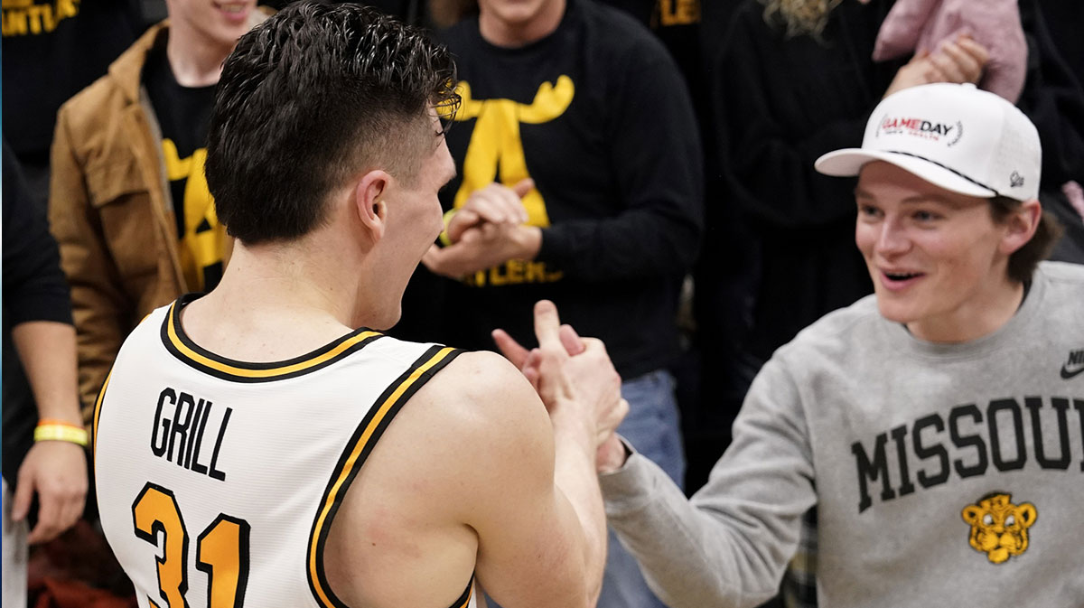 Missouri Tigers guard Caleb Grill (31) celebrates with fans after the win over the Alabama Crimson Tide at Mizzou Arena.