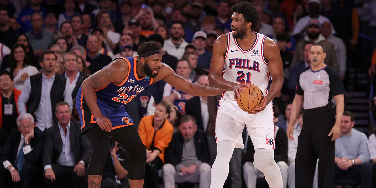 Philadelphia 76ers center Joel Embiid (21) controls the ball against New York Knicks center Mitchell Robinson (23) during the fourth quarter of game 5 of the first round of the 2024 NBA playoffs at Madison Square Garden. Mandatory Credit: Brad Penner-Imagn Images