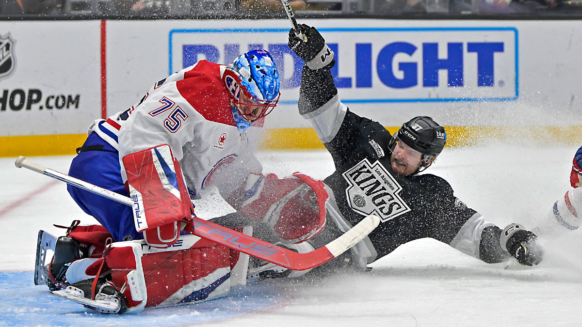 Los Angeles Kings left wing Warren Foegele (37) collides with Montreal Canadiens goaltender Jakub Dobes (75) as he was tripped up by defenseman Logan Mailloux (24) earning a penalty shot in the second period at Crypto.com Arena.