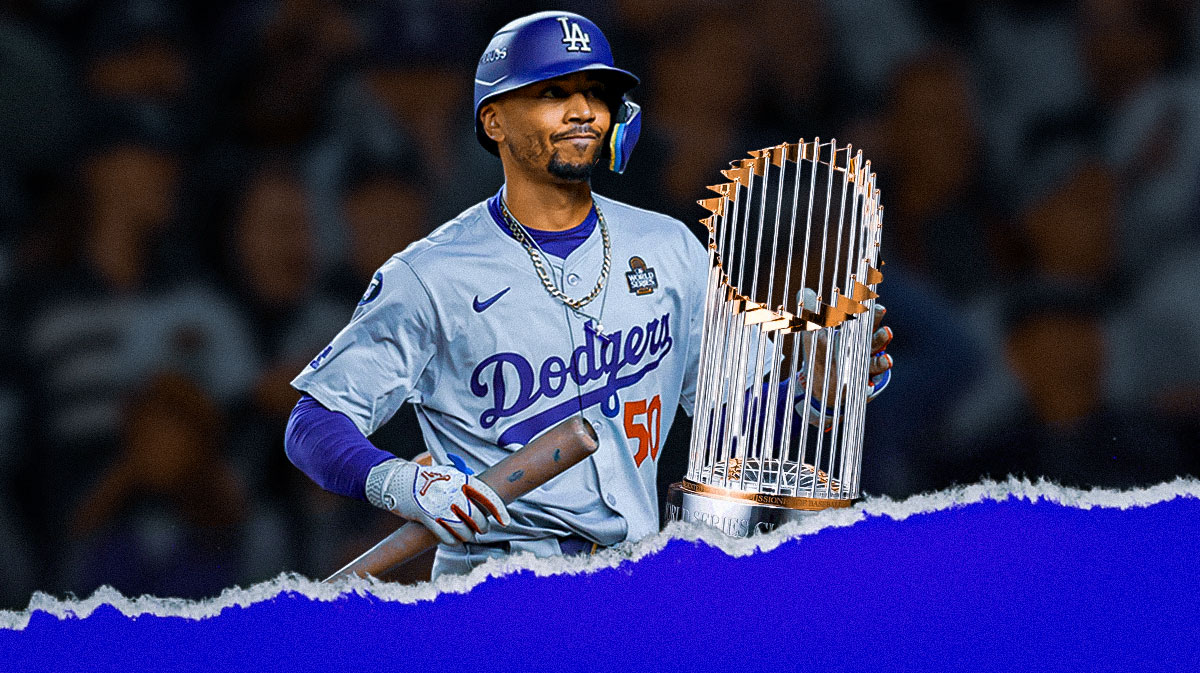 Mookie Betts next to World Series trophy