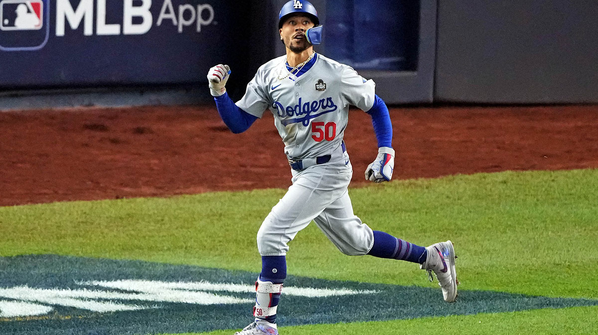Los Angeles Dodgers shortstop Mookie Betts (50) celebrates after hitting a sacrifice fly during the eighth inning against the New York Yankees in game four of the 2024 MLB World Series at Yankee Stadium.