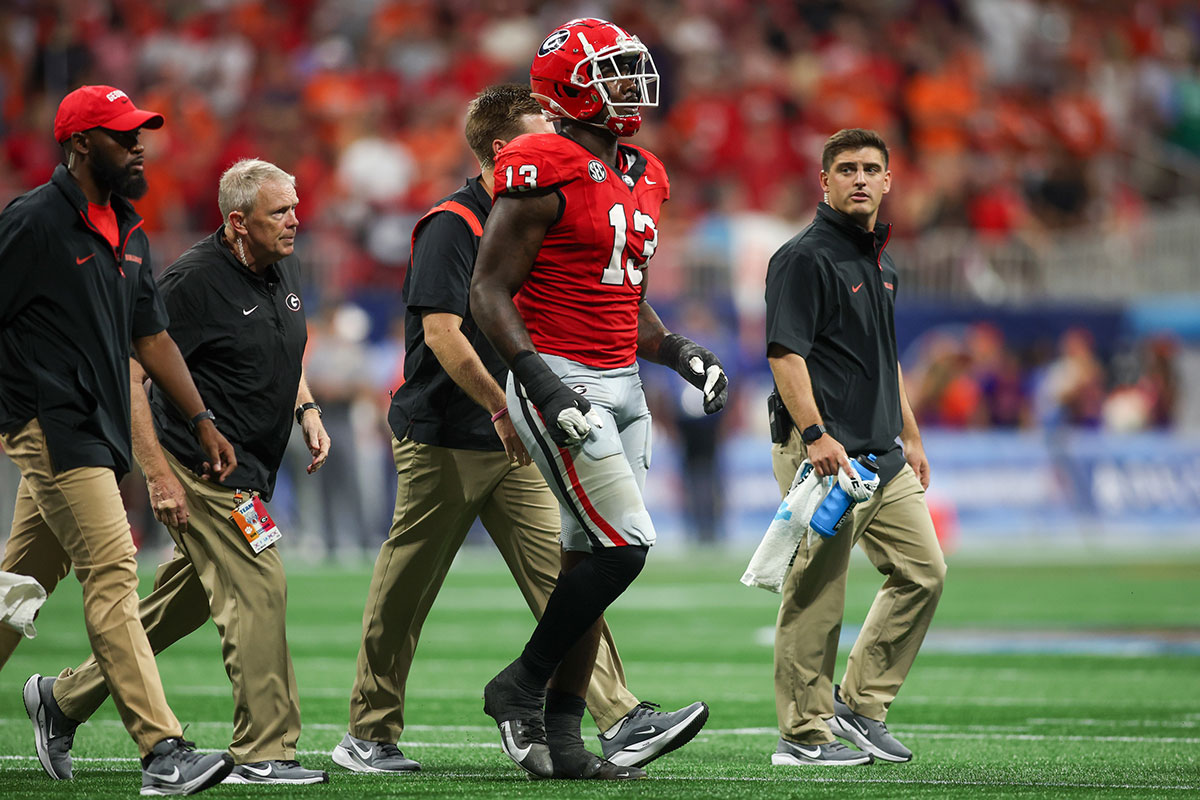 Aug 31, 2024; Atlanta, Georgia, USA; Georgia Bulldogs defensive lineman Mykel Williams (13) goes off the field with an injury against the Clemson Tigers in the third quarter at Mercedes-Benz Stadium.