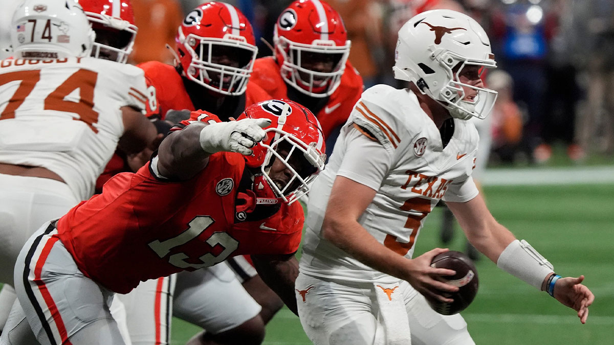 Georgia defensive lineman Mykel Williams (13) goes in for a sack on Texas quarterback Quinn Ewers (3) during the second half of the SEC championship game against Texas in Atlanta, on Saturday, Dec. 7, 2024.