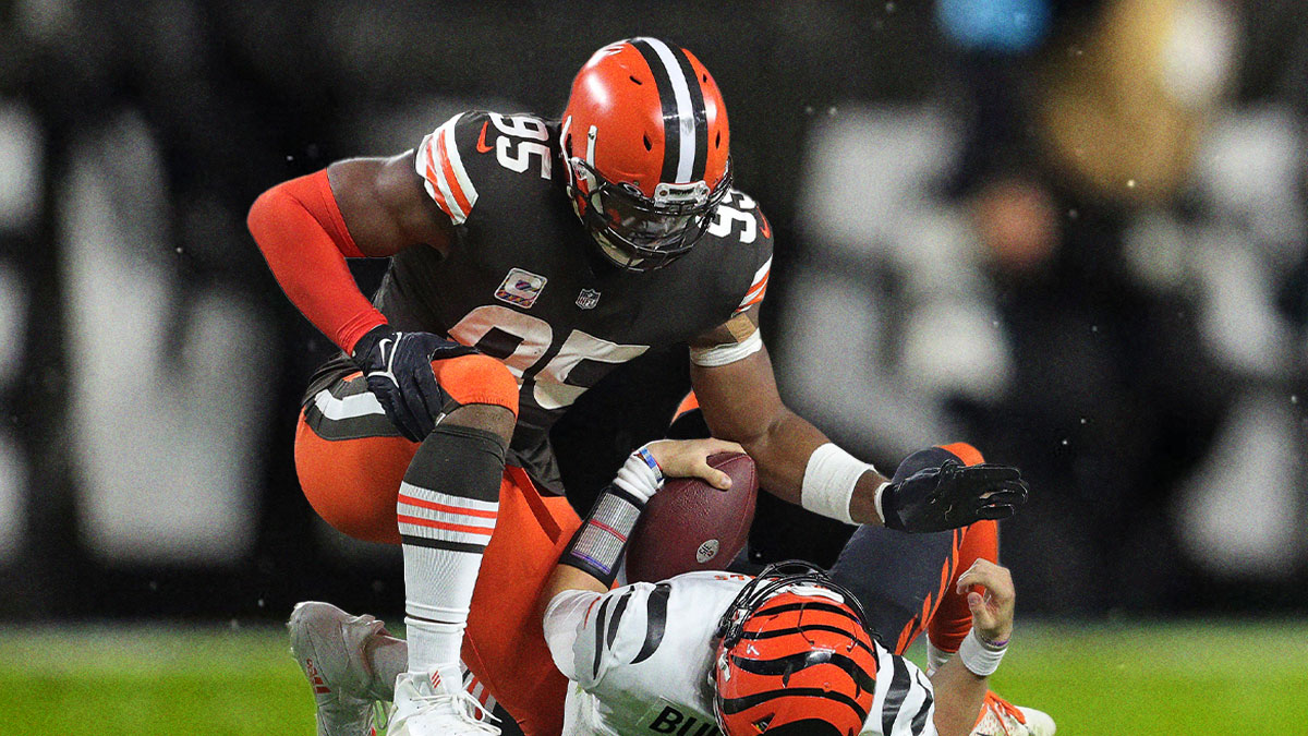 Cleveland Browns defensive end Myles Garrett (95) pats Cincinnati Bengals quarterback Joe Burrow (9) after sacking him during the second half of an NFL football game at FirstEnergy Stadium, Monday, Oct. 31, 2022, in Cleveland, Ohio.