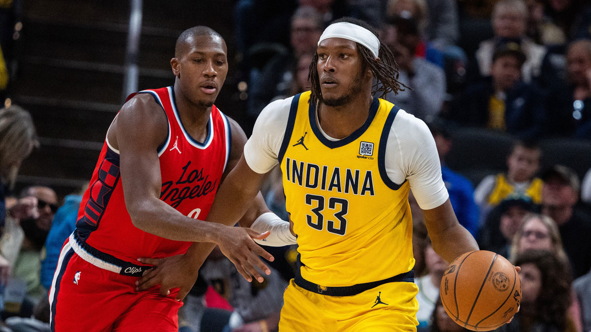 The Indiana Pacers Center Myles Turner (33) dribbles the ball while the goalkeeper of the Clippers Kris Dunn (8) defends in first half at Gainbridge Fieldhouse. 