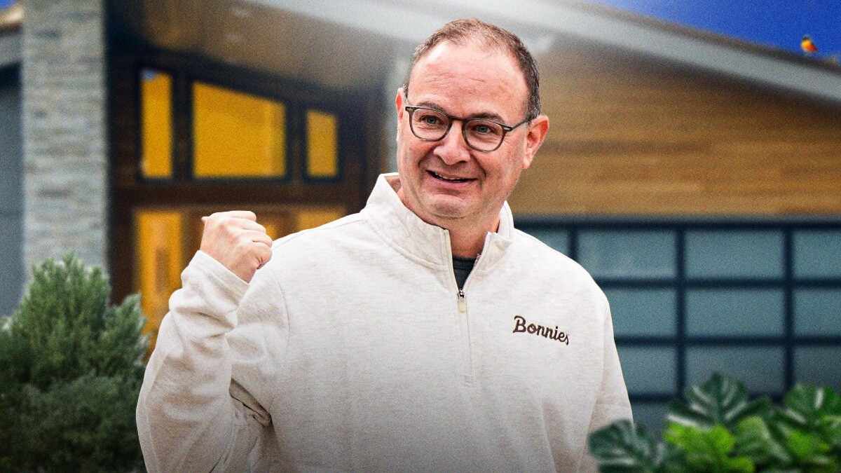 Adrian Wojnarowski smiling.