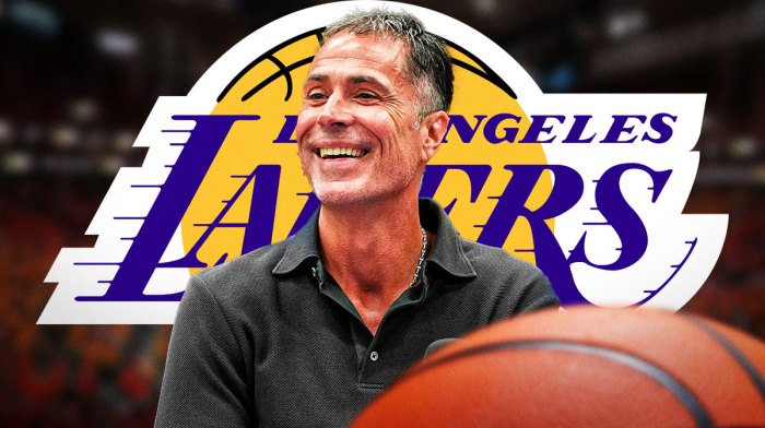 Lakers' Rob Pelinka next to Lakers logo