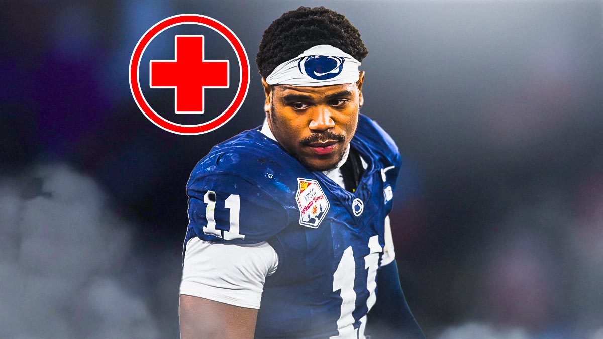 Abdul Carter (Penn State) looking serious and with medical cross symbol