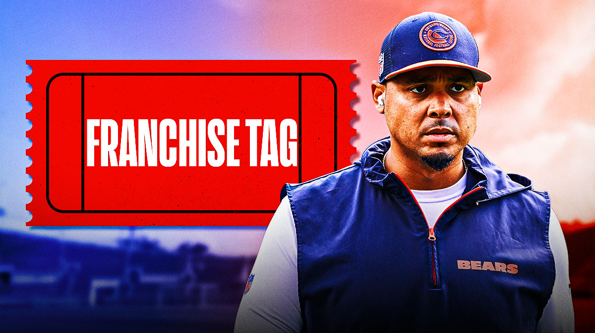 Chicago Bears general manager Ryan Poles next to a franchise tag
