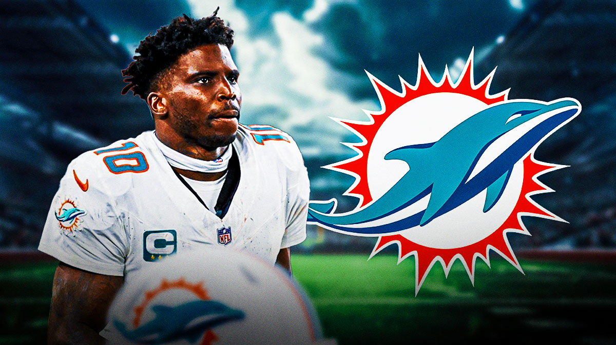 Tyreek Hill with Dolphins logo.