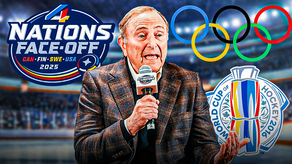 Gary Bettman. Olympics logo on his right. World Cup of Hockey logo on his right. 4 Nations Face Off logo on his left