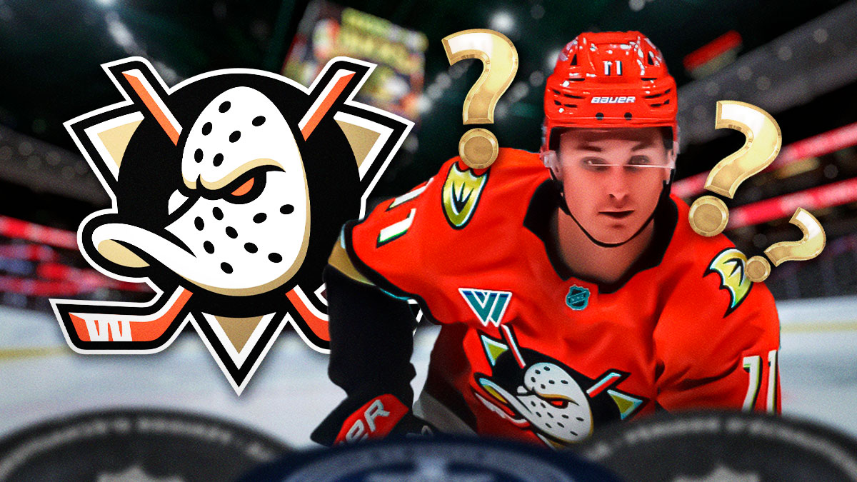 Trevor Zegras looking stern, 3-5 question marks, Anaheim Ducks logo, hockey rink in background