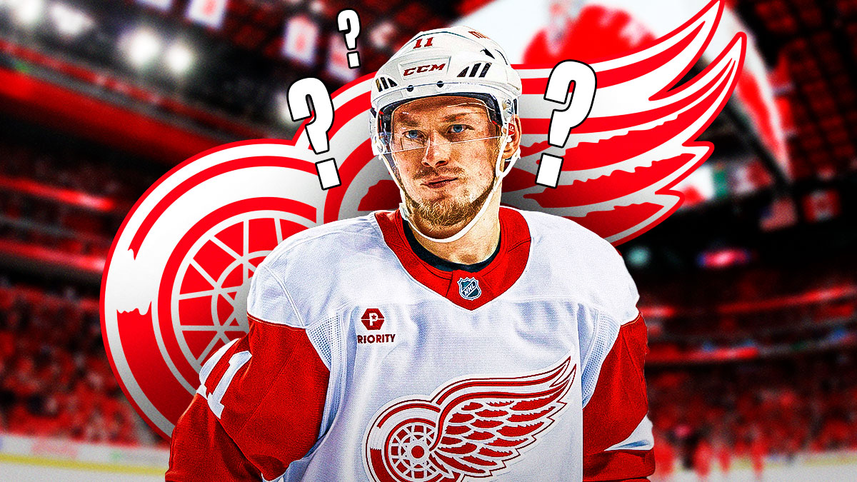 Vladimir Tarasenko in Detroit Red Wings jersey, 3-5 question marks, Detroit Red Wings logo in background, hockey rink in background