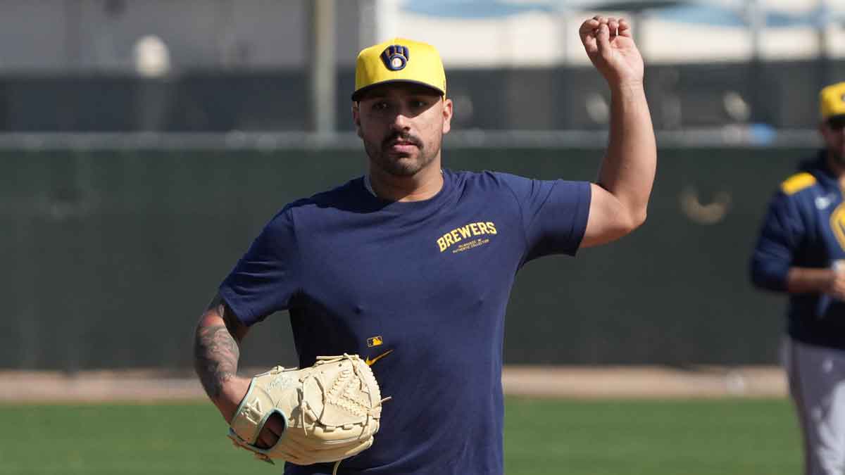 Milwaukee Brewers pitcher Nestor Cortes (65) runs through drills during spring training camp.