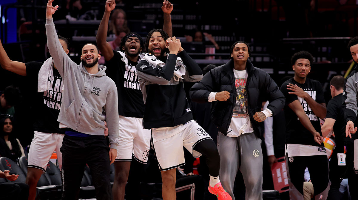 Brooklyn players on the bench react after the basket against Houston rockets during the fourth quarter in the center of Toyot.