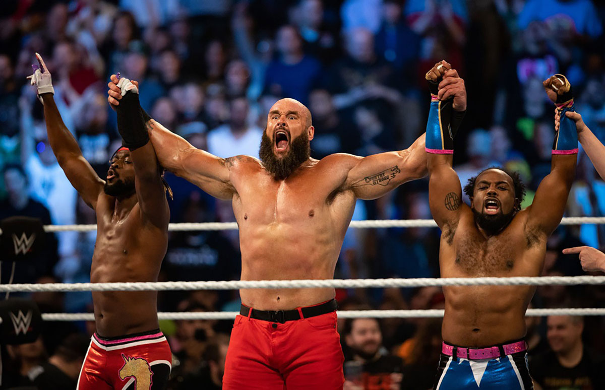 New Day's Kofi Kingston and Xavier Woods with Braun Strowman on October 7, 2022.