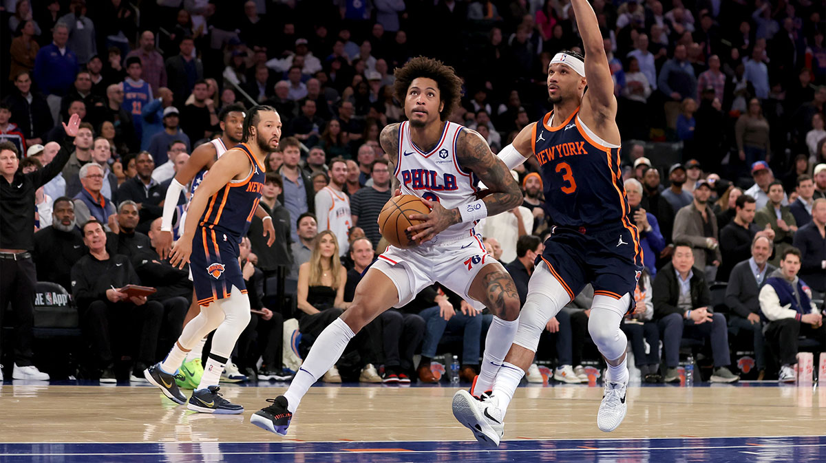 Philadelphia 76ers guard Kelly Oubre Jr. (9) drives to the basket against New York Knicks guards Josh Hart (3) and Jalen Brunson (11) during the fourth quarter at Madison Square Garden. 