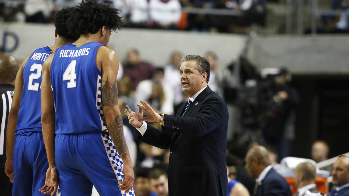 Kentucky Wildcats head coach John Calipari talks to forward EJ Montgomery (24) and forward Nick Richards (4) during the second half against the Auburn Tigers at Auburn Arena.