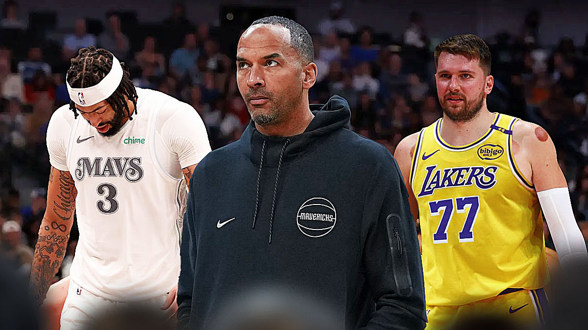Close-up image of Nico Harrison in front looking serious. In background, Mavericks Anthony Davis looking down/upset. In background, Lakers Luka Doncic looking serious.